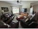 Comfortable living room designed for relaxation, featuring plush seating, and a large TV at 2711 Neverland Dr, New Smyrna Beach, FL 32168