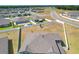 Spacious backyard features a playset, white fence, and an in-ground splash pad surrounded by green grass at 2995 Flying Blackbird Rd, Bartow, FL 33830