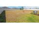 Large backyard features some green space, small tree and playground set at 2995 Flying Blackbird Rd, Bartow, FL 33830