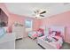 Bright and cheerful bedroom with twin beds and a ceiling fan at 2995 Flying Blackbird Rd, Bartow, FL 33830
