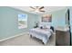 Cozy bedroom with a ceiling fan and a view of the outdoors at 2995 Flying Blackbird Rd, Bartow, FL 33830