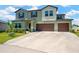 Attractive two-story home with a spacious driveway and an attached two-car garage at 2995 Flying Blackbird Rd, Bartow, FL 33830
