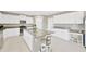 Bright kitchen features white cabinetry, granite countertops, and stainless steel appliances at 2995 Flying Blackbird Rd, Bartow, FL 33830