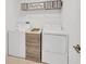 Laundry room with new washer and dryer, upper shelves and storage at 2995 Flying Blackbird Rd, Bartow, FL 33830