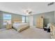 Spacious main bedroom with large windows, neutral color palette, and walk-in closet at 2995 Flying Blackbird Rd, Bartow, FL 33830