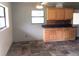 Dining area features natural light, slate tile flooring and wood cabinetry at 3015 Avenue I Nw, Winter Haven, FL 33881