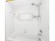 White shower and tub combo featuring a white tiled backsplash and modern shower head at 3379 Monika Cir, Orlando, FL 32812
