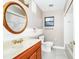 Bathroom with vanity, mirror, toilet, tub and shower combo and window at 3379 Monika Cir, Orlando, FL 32812