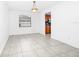Bright dining room featuring tile flooring and a pendant light fixture at 3379 Monika Cir, Orlando, FL 32812