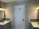 Bathroom featuring double sink vanity with modern backsplash at 37518 Quail Ridge Cir, Leesburg, FL 34788