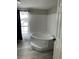 Bright bathroom features a corner soaking tub and window at 37518 Quail Ridge Cir, Leesburg, FL 34788