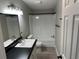 Bathroom featuring vanity, sink, mirror, toilet, and shower tub at 37518 Quail Ridge Cir, Leesburg, FL 34788