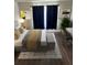 Modern bedroom design with a desk, chair, and plant for a functional and stylish space at 37518 Quail Ridge Cir, Leesburg, FL 34788