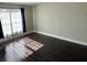 Bedroom with hardwood floors, neutral paint, and good natural light from the window at 37518 Quail Ridge Cir, Leesburg, FL 34788