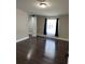 Bedroom with wood floors, closet, and natural light at 37518 Quail Ridge Cir, Leesburg, FL 34788