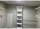 Walk-in closet with shelving, rods and lighting at 37518 Quail Ridge Cir, Leesburg, FL 34788