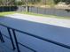 A spacious gray deck provides ample room for outdoor seating and entertaining, overlooking the backyard at 37518 Quail Ridge Cir, Leesburg, FL 34788