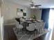 Bright dining room featuring a modern table setting, elegant decor, and a ceiling fan at 37518 Quail Ridge Cir, Leesburg, FL 34788