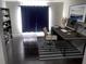 Bright home office space with dark wood floors, modern desk, and built-in shelving at 37518 Quail Ridge Cir, Leesburg, FL 34788
