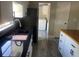 Kitchen features dark granite countertops, stainless steel appliances, and white cabinets at 37518 Quail Ridge Cir, Leesburg, FL 34788
