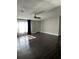 Bright living room featuring hardwood floors and a ceiling fan at 37518 Quail Ridge Cir, Leesburg, FL 34788