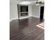 Spacious living room with wood flooring and modern fireplace at 37518 Quail Ridge Cir, Leesburg, FL 34788