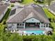 An aerial view of a private pool, patio, and lounge area of this luxury property at 3883 Grassland Loop, Lake Mary, FL 32746