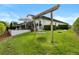 Lovely backyard featuring a cozy swing set and a patio area perfect for Gathering enjoyment and relaxation at 3883 Grassland Loop, Lake Mary, FL 32746
