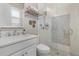 Beautiful bathroom with white cabinetry, countertop, a glass-enclosed shower with sleek fixtures, and updated finishes at 3883 Grassland Loop, Lake Mary, FL 32746