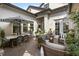 Relaxing courtyard with brick pavers, stylish patio furniture, and lush greenery at 3883 Grassland Loop, Lake Mary, FL 32746