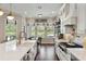 Bright kitchen with a large island, modern appliances, and an inviting breakfast nook with views of the outdoors at 3883 Grassland Loop, Lake Mary, FL 32746