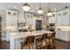 Well-equipped kitchen featuring a large island, pendant lighting, and stainless steel appliances at 3883 Grassland Loop, Lake Mary, FL 32746