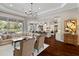 Open-concept living area with a view of the kitchen, showcasing the spacious design ideal for entertaining at 3883 Grassland Loop, Lake Mary, FL 32746