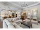 Open-concept living space with stylish decor, seamless flow to the kitchen, and hardwood floors at 3883 Grassland Loop, Lake Mary, FL 32746