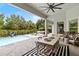 Inviting pool area with patio seating, creating a relaxing outdoor space for leisure and entertaining at 3883 Grassland Loop, Lake Mary, FL 32746