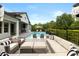 Beautiful outdoor seating area beside the pool with comfortable seating and elegant decor at 3883 Grassland Loop, Lake Mary, FL 32746