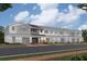 Scenic townhome exteriors with personal garages, colorful landscaping, and pleasing curb appeal at 4287 Campsite Loop, Orlando, FL 32824