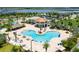 Resort-style pool with beach entry, lazy river, sun loungers, and a tropical oasis at 4772 Kings Castle Cir, Kissimmee, FL 34746