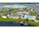 Aerial view of the community amenities, including a pool, lazy river, and recreation areas at 4772 Kings Castle Cir, Kissimmee, FL 34746