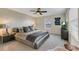 Comfortable bedroom with a ceiling fan and gray bedding providing a relaxing and cozy space at 4772 Kings Castle Cir, Kissimmee, FL 34746
