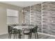 Elegant dining room with modern decor, a stylish chandelier, and comfortable seating for eight at 4772 Kings Castle Cir, Kissimmee, FL 34746
