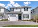 Charming two-story home with a well-maintained front yard and a private, one-car garage at 4772 Kings Castle Cir, Kissimmee, FL 34746