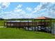Scenic view of the community lake and dock, perfect for enjoying nature and relaxation at 4772 Kings Castle Cir, Kissimmee, FL 34746