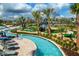 Stunning lazy river and mini golf featuring clear blue water and lush green landscaping at 4772 Kings Castle Cir, Kissimmee, FL 34746