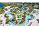 Beautiful lazy river featuring clear blue water, palm trees, and landscaping at 4772 Kings Castle Cir, Kissimmee, FL 34746