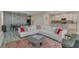 Open-concept living room with stylish furniture, an adjacent dining area, and a bright, airy atmosphere at 4772 Kings Castle Cir, Kissimmee, FL 34746