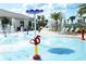 Community splash pad with water features and play areas for children at 4772 Kings Castle Cir, Kissimmee, FL 34746