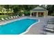 Beautiful community pool with ample seating and a poolside pavilion, perfect for relaxation and socializing at 4793 Grassy Knoll Dr, Tavares, FL 32778