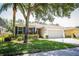 Well-maintained single-Gathering home with attractive landscaping and a spacious driveway at 4793 Grassy Knoll Dr, Tavares, FL 32778