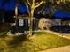 Charming home exterior with a well-maintained lawn, landscape lighting, and a neatly paved driveway at 4793 Grassy Knoll Dr, Tavares, FL 32778